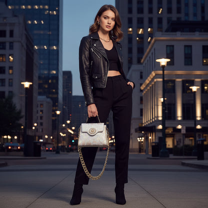 White lace handbag with gold chain strap on a white background